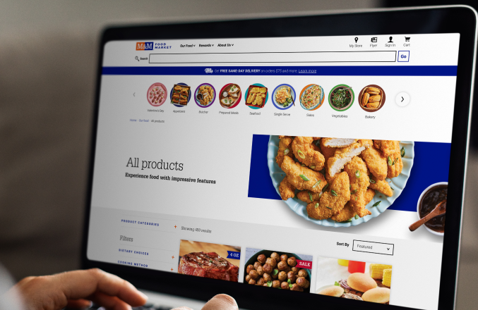 An open laptop displaying M&M Food Market's All Product's page.