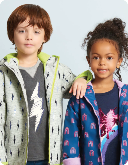 Two kids, side by side, wearing clothes from hatley.com.